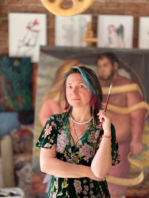 artist Tetiana Cherevan in front of her favorite art work